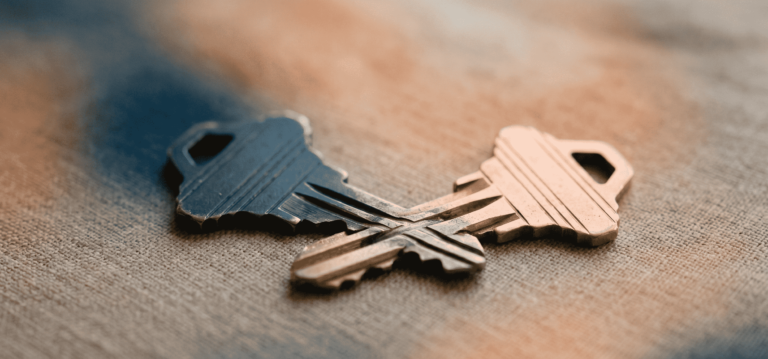 common law partners - Two house keys gently interlocking and partially merging into one
